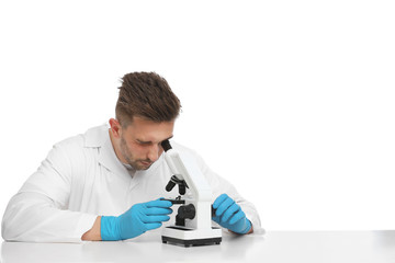 Scientist using modern microscope at table isolated on white. Medical research
