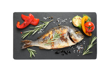 Delicious roasted fish and vegetables isolated on white, top view