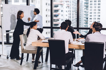 Group of professional business meeting and discussing strategy with new startup project.Creative business people planning and brainstorm with document report in modern workloft.Teamwork concept