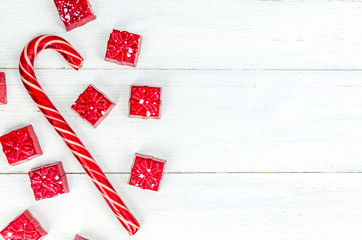 Fototapeta premium Christmas. New Year's Eve. Background. red candy in the form of gifts on a white background