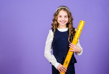 small girl back to school. Pupil girl with big ruler. STEM school disciplines. School student learning geometry. math lesson. Education and knowledge. Maths and geometry