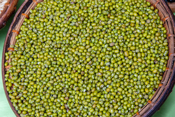 Green beans or pea nut or peanut in wooden bamboo vintage basket style.