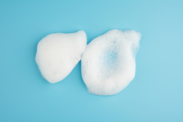 Group of foam bubble on blue background on top view object beatuy health care concept design
