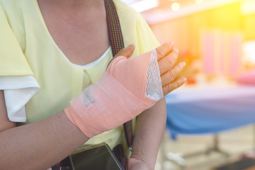 first aid hand with bandaged