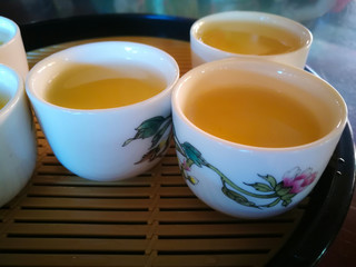 Tea water in cute or small white glass.