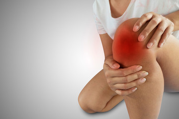 A woman with knee pain, isolated background