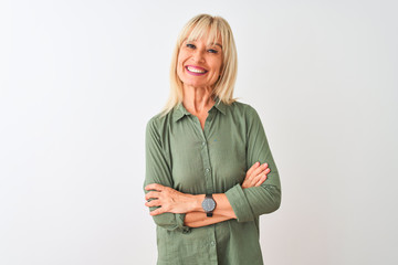 Middle age woman wearing green casual shirt standing over isolated white background happy face...