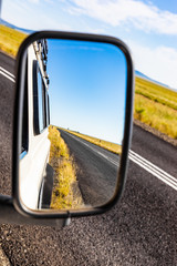 Rear view in a side Mirror of 4x4 vehicle © Sunshine Seeds