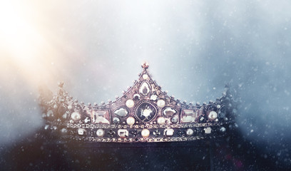 mysterious and magical photo of of beautiful queen/king crown over gothic snowy dark background....