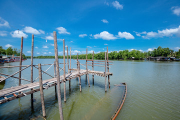 Wooden bridge of Brackish water in sea of Trat province, Thailand.