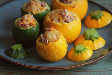 Roasted round zucchini stuffed with minced meat, vegetables, and cheese