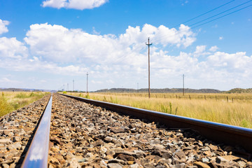 Fototapeta na wymiar railway track in countryside rural farmland area of South Africa