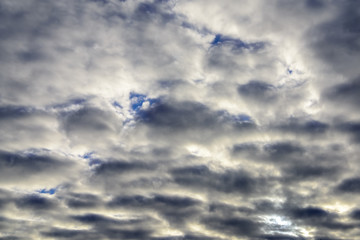 Beautiful puffy pastel colored clouds against blue skies.