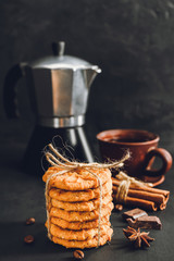 Homemade chip cookies stacked on dark background