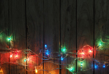 Christmas rustic background - old wood with lights and free text
