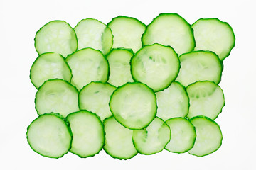 Green cucumber cross section slices pattern isolated on white background, top view. Fresh juicy food concept. Ingredient for cosmetic