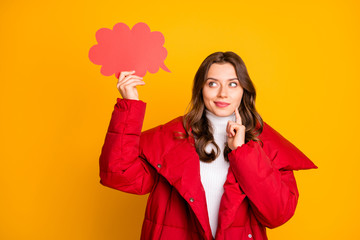 Photo of charming pretty lady holding empty paper cloud have creative idea to fill it finger on cheek clever person wear red winter overcoat isolated yellow color background © deagreez