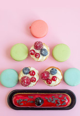 sweets macaroons and cakes in in the shape of Christmas tree, creative concept of New Year and Christmas