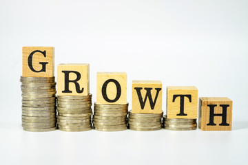 Business concept of growth on investment on white background, Stack coins and text box.