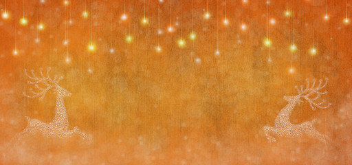 Christmas time. Golden and orange blur abstract background with reindeers and snowflakes. Blur shiny Christmas lights.