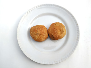 indian desert fresh kachori put in white plate isolated on white background