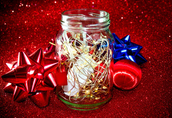 Christmas ornaments on red background with lights like stars