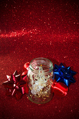 Christmas ornaments on red background with lights like stars