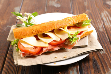 sandwich with ham, tomato and sauce