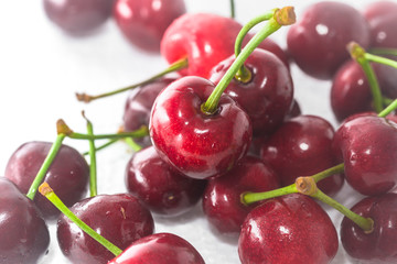 A few fresh cherries on a white background