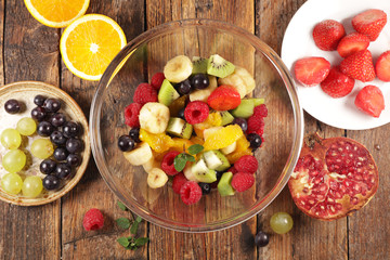 fresh fruit salad with orange, berry, kiwi