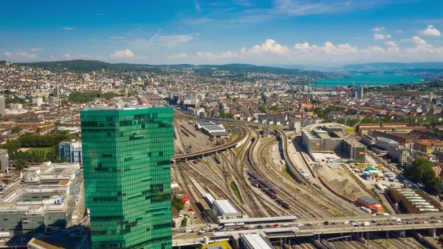 flight over zurich city industrial district railway traffic sunny day aerial panorama 4k timelapse switzerland 