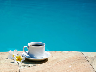 Cup of coffee on the pool villa