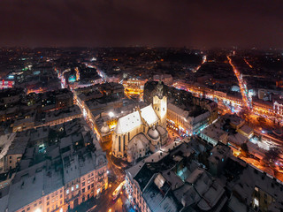 Fototapeta premium Aerial view on Latin cathedral in winter Lviv from drone
