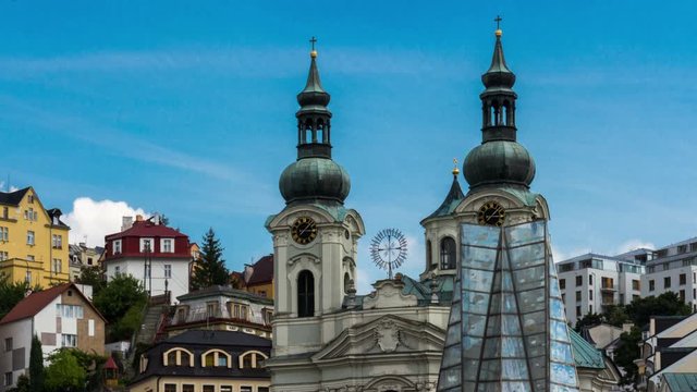 Karlovy Vary (Carlsbad) Czech Republic. Mary Magdalene Church close-up. Town tower clock. Ttimelapse	