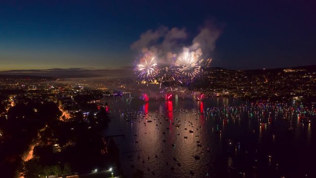 sunset night zurich city summer holiday firework lake aerial panorama 4k timelapse switzerland 