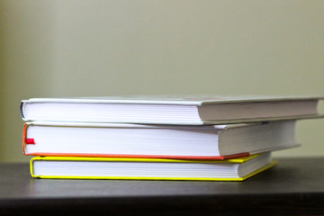 Books on the wooden table in the room