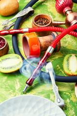 Fragrant smoking hookah with kiwi