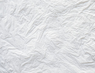 Close-up texture of Crumpled white color tissue paper background abstract. Detail texture of pattern with free space copy for text.