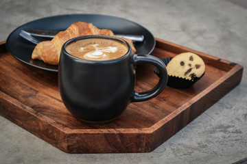 A cup of coffee with latte art on top
