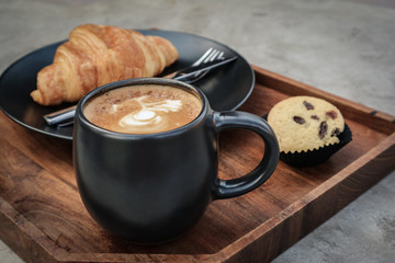 A cup of coffee with latte art on top