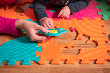 baby Puzzle with colourful letters. family time