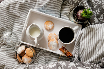 breakfast in bed. top view. Coffee with cookies on a tray