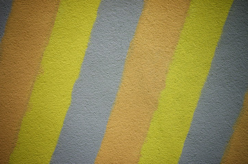 Wall painted in vibrant color stripes.
