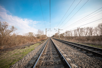 Obraz na płótnie Canvas Train rails in country landscape