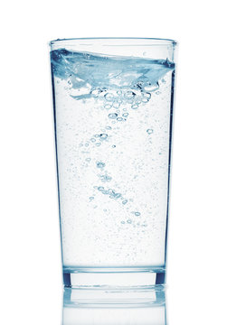 one glass of sparkling water on a white background, isolated object