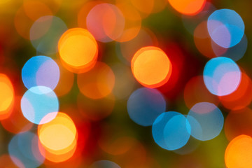 Abstract festive blurry background. Beautiful bokeh. Camera lenses effect. Round spots of light.