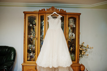 Elegant white wedding dress at bride morning.