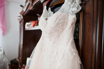 Elegant white wedding dress at bride morning.