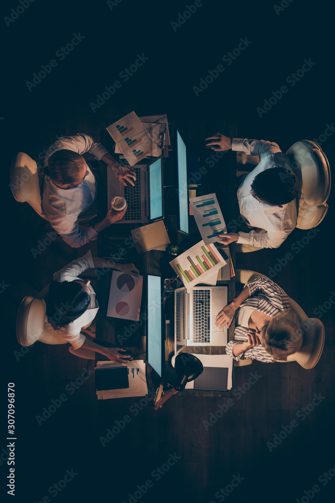 Poster vertical top above high angle view of four hardworking entrepreneurs it experienced skilled managers