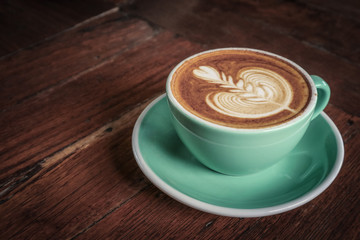 A cup of coffee with latte art on top